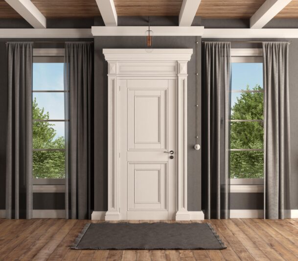 Elegant entryway with white door.