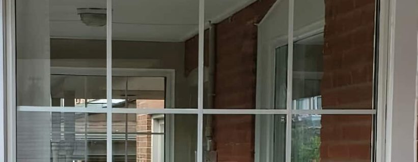 Reflection in a window with brick wall