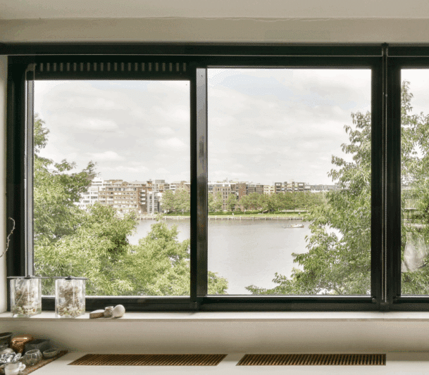 View of a river through large single lift-out slider window.