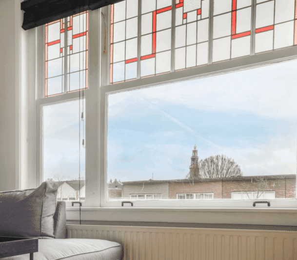 Stained glass window with tower view