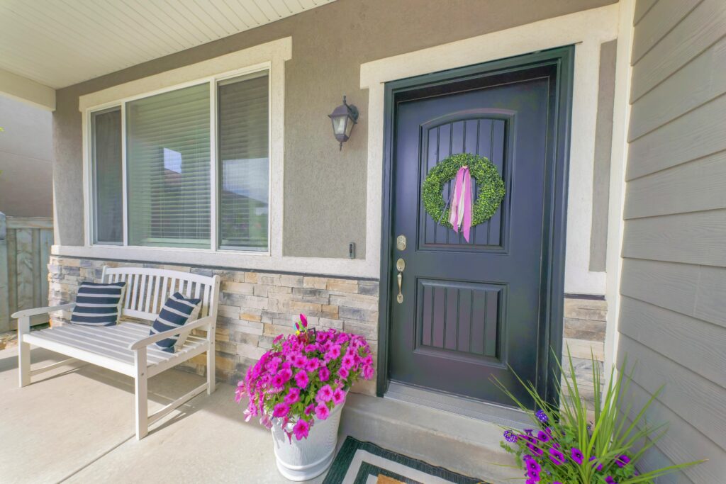 Front porch with flowers and wreath