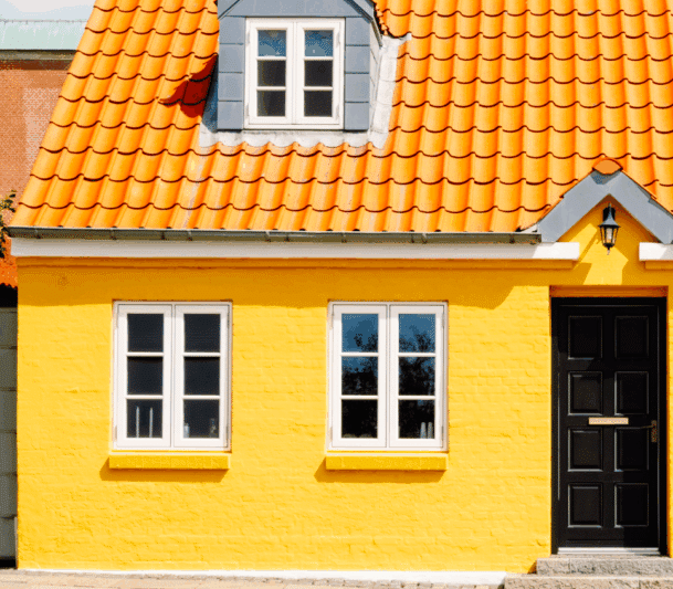 Bright yellow house with orange roof