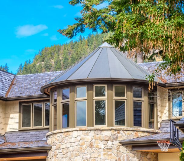 Modern house with stone turret design.