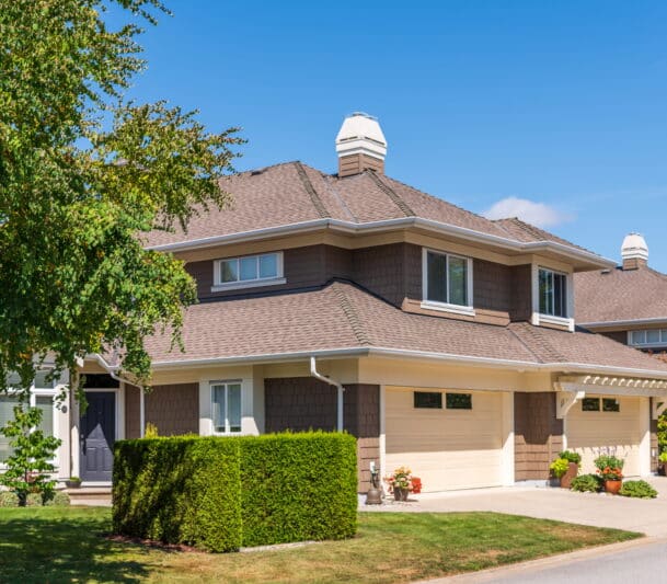 Two-story suburban house on a sunny day.