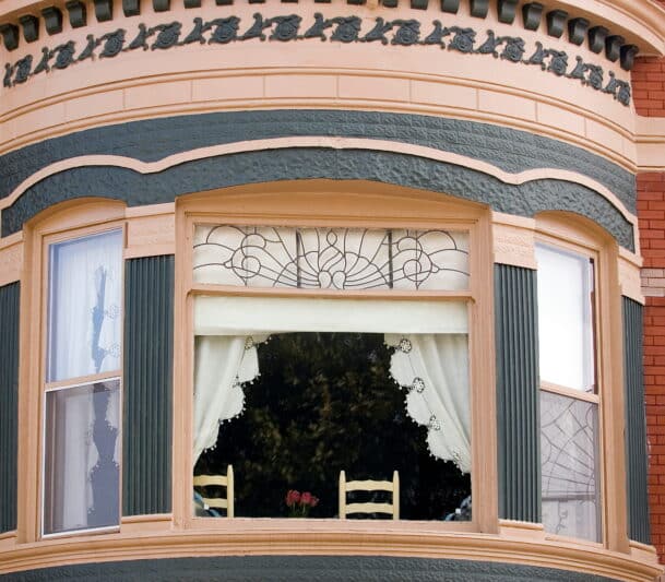 Bay window with lace curtains.