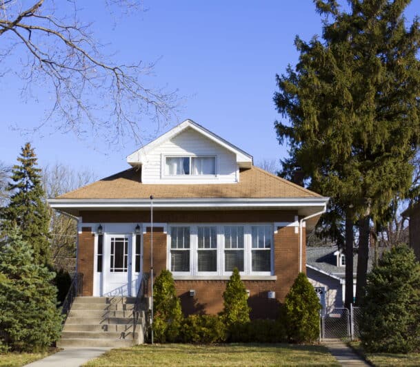 Single-story brick house with porch.