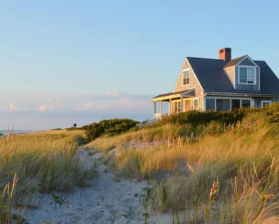 coastal Canadian home with double-hung windows and covered porch, window rebate program Canada