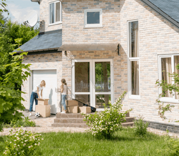 Family unpacking boxes at new home