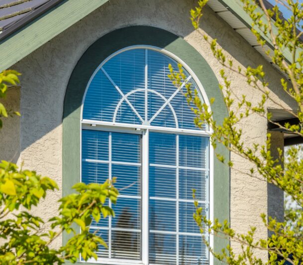 Arched window with green trim