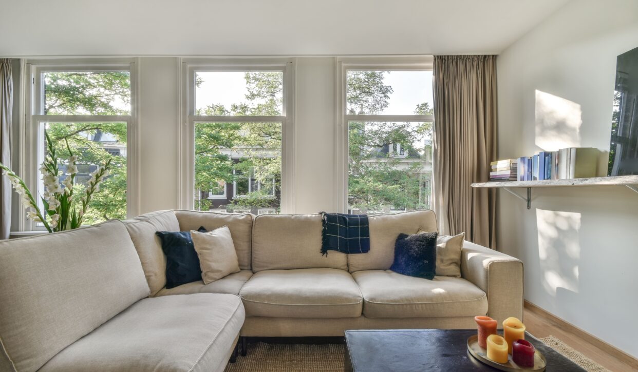 Cozy living room with tan sofa.