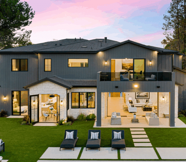 Modern home with patio at sunset