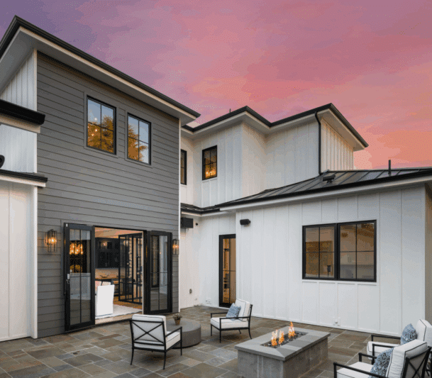Modern home exterior with patio at sunset